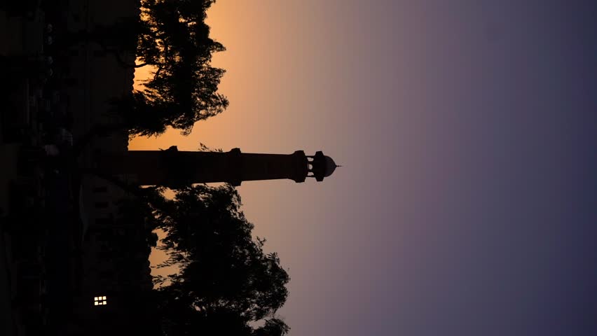 Sunset in the city. The sun is hidden behind the bulding.