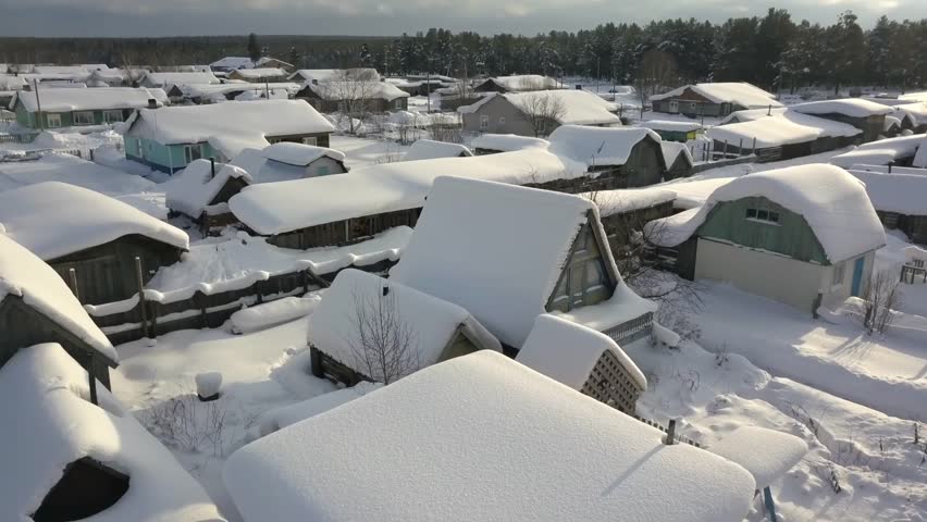 Snowy village from above. Snowcovered houses form picturesque winter scene
