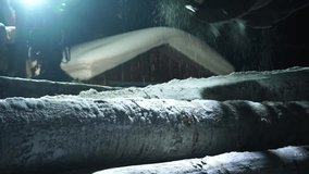 Snowy winter work with logs stack in the snow. Industrial in village.  - Powered by Shutterstock - Get 15% off with code: PIKWIZARD15