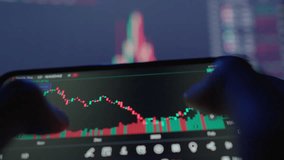 Investors use smartphones to analyze stock market trends, make investment decisions, and track stock prices using live data. Technology and digital tools enable realtime financial analysis - Powered by Shutterstock - Get 15% off with code: PIKWIZARD15