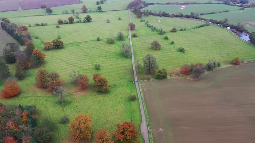 Aerial footage of the British town of Wetherby in Leeds West Yorkshire  showing the typical country side by the village of Little Ribston on a cold day in the Autumn time