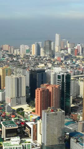 Skyline of Manila city, the capital of Philippines, wide view, vertical video.