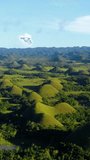 Chocolate Hills of Bohol, geological formation, tropical nature, vertical video.