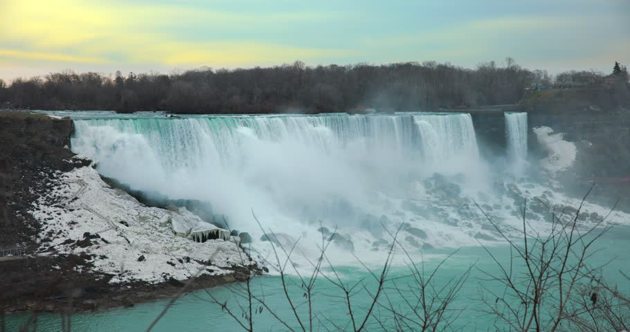 This is a shot of the american Falls at Niagara falls during a sunrise. Shot from the canadian side slightly upstream.