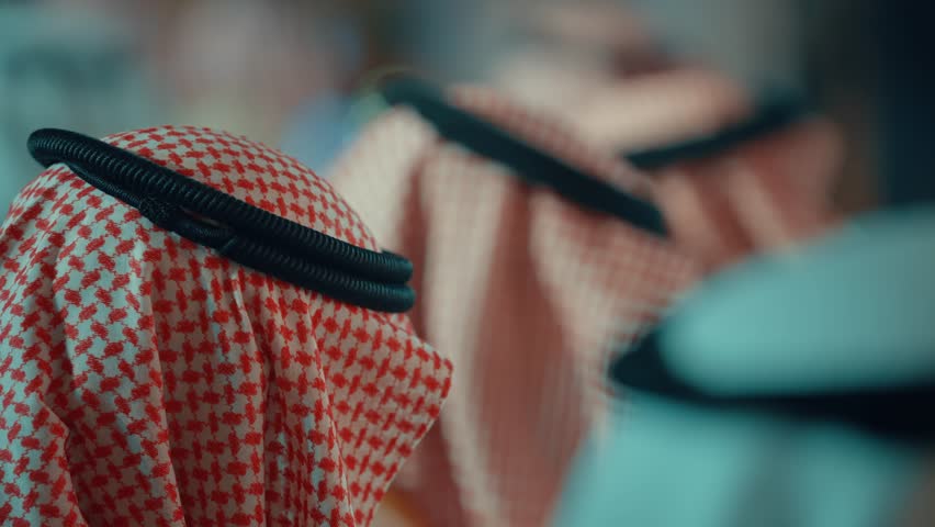 A group of people wearing Saudi uniforms
