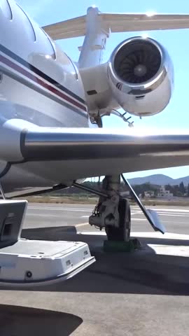 Business Jet Open Door Stairs Upwards Panning Generic White Unmarked Stripes