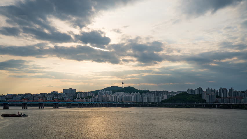 Day to Night Timelapse in Seoul Stunning Transition from Daylight to City Lights big city skyline time-lapse shot South,Korea, high skyscrapers illumination reflected on Han river.Downtown cityscape  