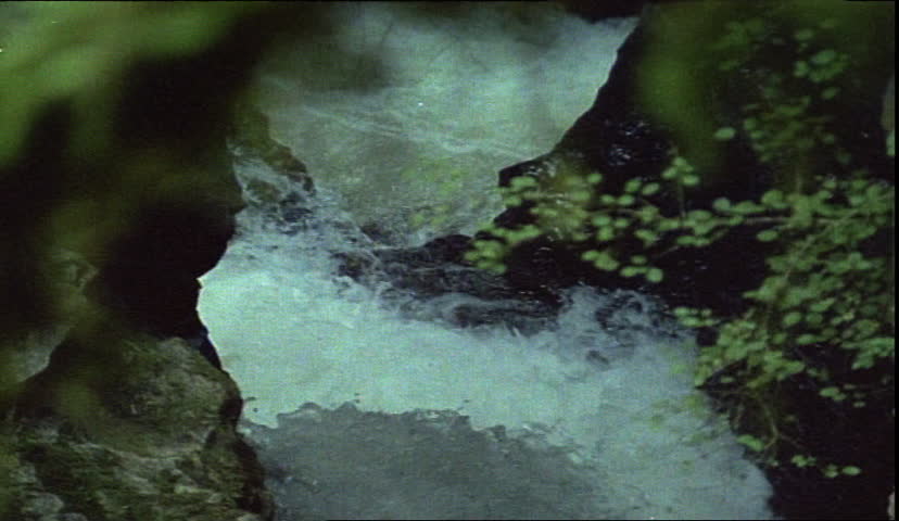 closeup on stream passing through limestone caves