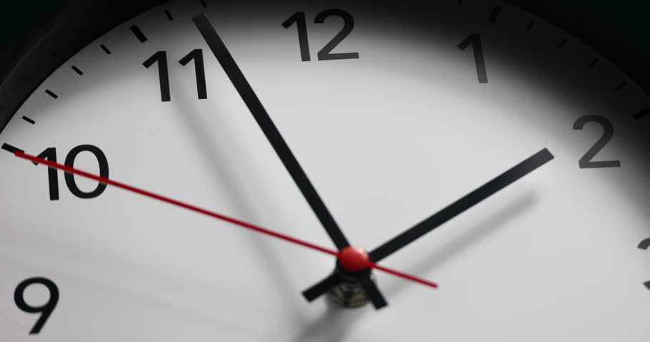 Cinematic High-angle Close-up Shot of White Office Wall Clock with Red Second Hand that Counting Down the Seconds to Two. Concept: Anticipation, Deadline, Tension and Passage of time. Real Time Clock
