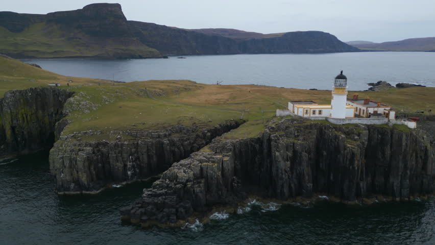 Neist Point Lighthouse on Steep Cliff Isle of Skye Landscape AERIAL