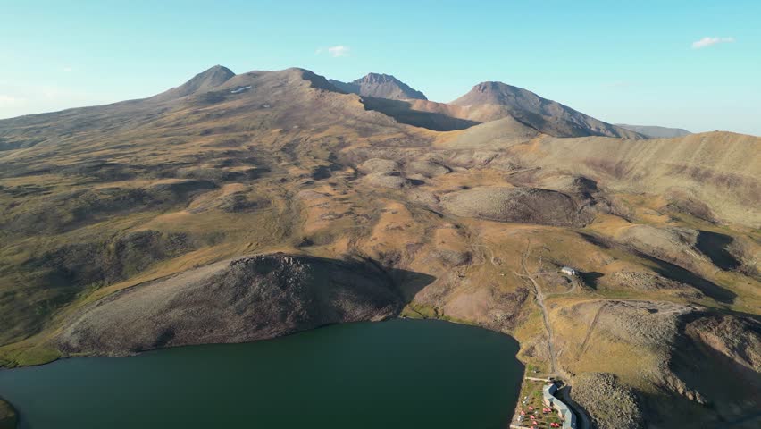 Aerial over Keri Lake in Armenia looks toward Mt Aragats volcano