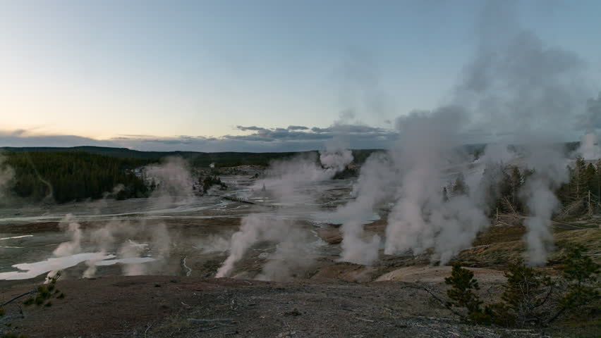 Timelapse of sunset sky over Norris Geyser Basin in Yellowstone National Park in Wyoming, USA