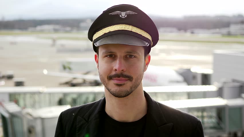 Portrait of Proffesional Male Pilot Captain Working in Aviation Business