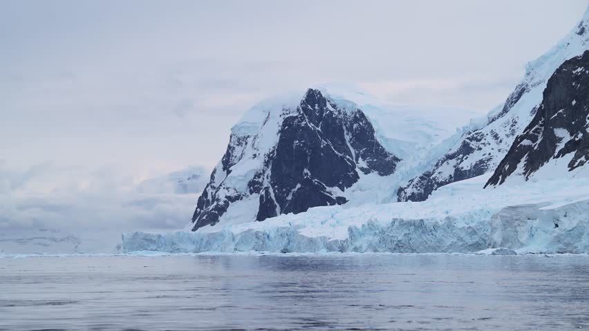 Glacier and Mountains at Sunset on Coast, Antarctica Mountain Landscape of Coastal Scenery, Blue Winter Scene with Ice and Ocean Sea Water, Antarctic Peninsula Seascape in Beautiful Dramatic Scene