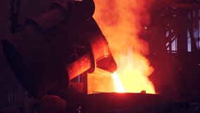 Pouring liquid metal from ladle in blast furnace foundry metallurgical factory. Steel mill iron smelting process - Powered by Shutterstock - Get 15% off with code: PIKWIZARD15