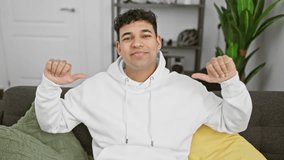 Cheerful young arabian man in casual gear, proudly pointing at himself, looking mighty confident in his living room! - Powered by Shutterstock - Get 15% off with code: PIKWIZARD15