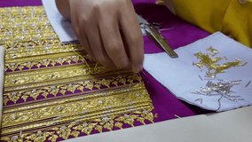 Thai patterns embroidery work with gold metallic yarn, the ancient ornamental clothes - Powered by Shutterstock - Get 15% off with code: PIKWIZARD15