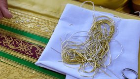 Thai patterns embroidery work with gold metallic yarn, the ancient ornamental clothes - Powered by Shutterstock - Get 15% off with code: PIKWIZARD15