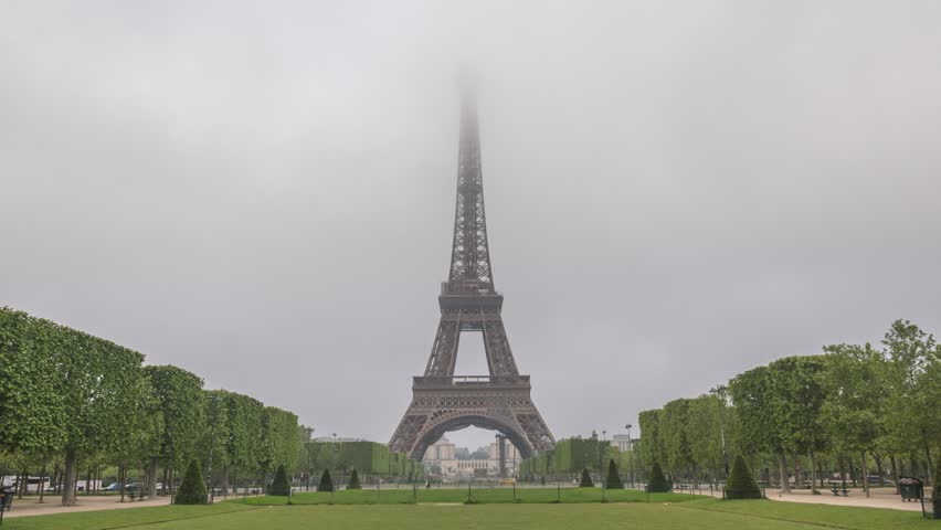 Paris France time lapse, city skyline at Eiffel Tower and Champ de Mars garden