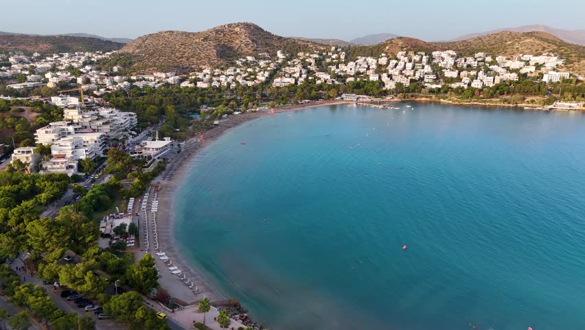 Aerial sunset view of the popular beach and bay of Vouliagmeni, south Athens suburb, Greece