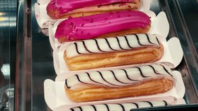 Delectable Eclairs: A Mouthwatering Display of Creamy Delights at the Bakery (Raspberry and Vanilla Glazed Choux Pastries) - Powered by Shutterstock - Get 15% off with code: PIKWIZARD15