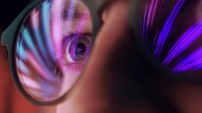 Eyes of Man in Glasses Looking at Computer Screen with Glowing Video of Internet Simulation. Concentrated Sight of Addictive Person Spending Time Online and Staring at Moving Image. Macro Shot View - Powered by Shutterstock - Get 15% off with code: PIKWIZARD15