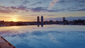 barcelona skyline shot with reflection in rooftop swimming pool of sun rising - Powered by Shutterstock - Get 15% off with code: PIKWIZARD15