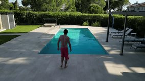Man jumping into the pool in summer. - Powered by Shutterstock - Get 15% off with code: PIKWIZARD15