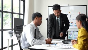 Financial Analyst Group Business financial report on laptop and graph document during corporate meeting discussion which shows successful teamwork Business and marketing meeting ideas. - Powered by Shutterstock - Get 15% off with code: PIKWIZARD15