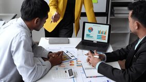 Financial Analyst Group Business financial report on laptop and graph document during corporate meeting discussion which shows successful teamwork Business and marketing meeting ideas. - Powered by Shutterstock - Get 15% off with code: PIKWIZARD15