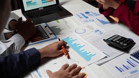 Business concept: group of Asian businessmen discussing, consulting, meeting and calculating charts and graphs showing the growth of financial investment results. online marketing Successful teamwork - Powered by Shutterstock - Get 15% off with code: PIKWIZARD15