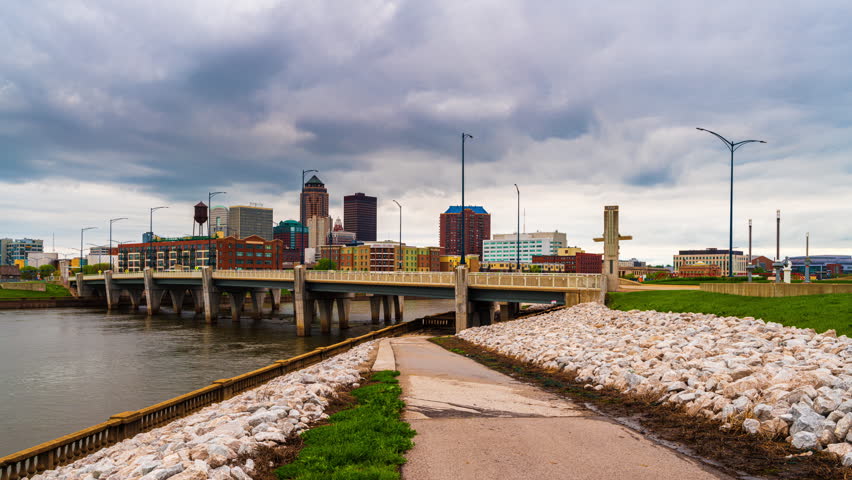Des Moines, Iowa, USA downtown cityscape on the river at twilight.