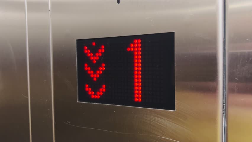 Elevator display, going down from the first floor to the ground floor.