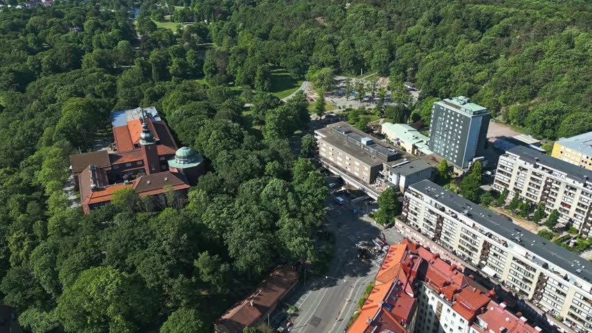 Flying over Plikta playground in Slottsskogen city park and to the bottom left is the Gothenburg Museum of Natural History in Gothenburg, Sweden