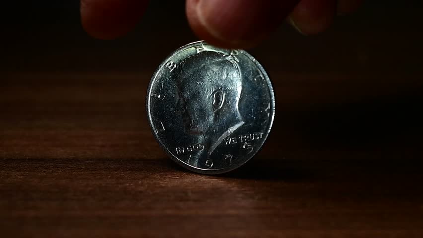 Half Dollar turning on a table