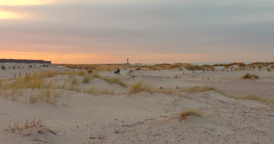 Serene dunes at sunset in Dunkirk, France, the historic site of a major World War II event