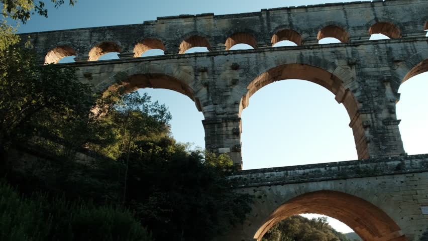 Languedoc, France - 09 22 2021: ancient Roman aqueduct Pont du Gard near Languedoc, France, built as part of the infrastructure for water supply of the roman empire.