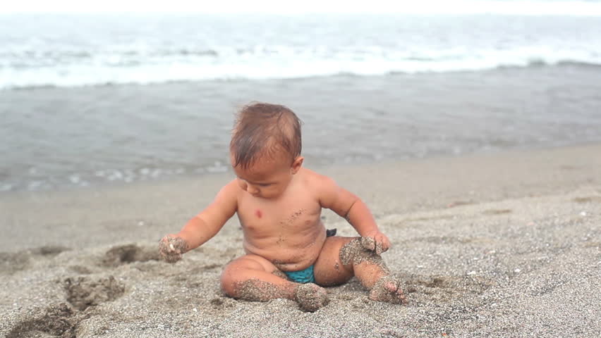 A cute girl playing with a sand