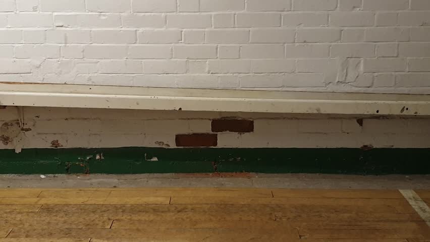 Three wooden balls rolling down shoot on skittles alley, traditional English pub game