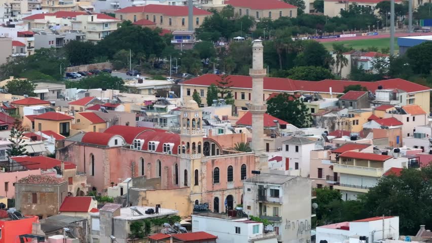 View of Chania with the amazing lighthouse, mosque, venetian shipyards, Crete, Greece.Waves crashing on lighthouse, Beautiful Greece and best scenic places - panorama