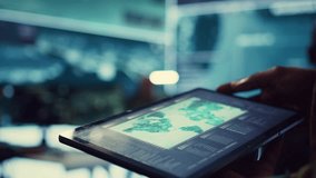 Navy operations specialist examines a world map with gps system on his tablet, working on finding tracks of enemy vessels. General employs government satellite data for missions. Close up. Camera B. - Powered by Shutterstock - Get 15% off with code: PIKWIZARD15