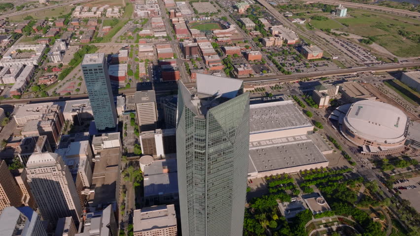 Aerial view of a towering skyscraper and urban landscape in Oklahoma City, highlighting the city's architecture and layout from a high vantage point