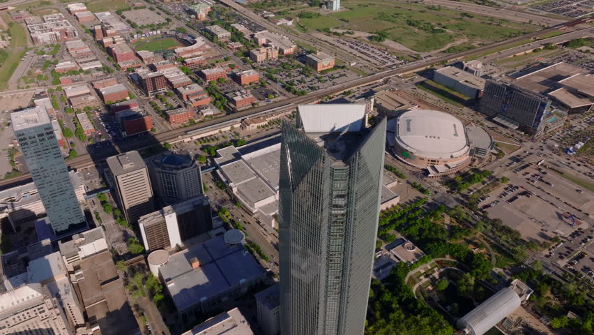 Aerial view of a towering skyscraper and urban landscape in Oklahoma City, highlighting the city's architecture and layout from a high vantage point