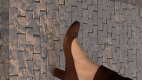 Legs of businesswoman walking along a sunlit urban street. Black heeled shoes exude professionalism and sophistication. Concept of business attire, urban lifestyle, and career success. Vertical video - Powered by Shutterstock - Get 15% off with code: PIKWIZARD15