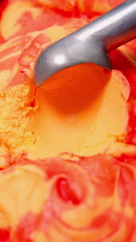 Scoop scoop of ice cream with spoon. Cold dessert concept.