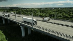 Long distance truck freight. Big lorry cargo transportation drone view from above. Large van drive city street highway. Road way logistic. Fast heavy semi trucks goods delivery. Trucker driver move. - Powered by Shutterstock - Get 15% off with code: PIKWIZARD15