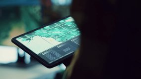 Navy operations specialist examines a world map with gps system on his tablet, working on finding tracks of enemy vessels. General employs government satellite data for missions. Close up. Camera A. - Powered by Shutterstock - Get 15% off with code: PIKWIZARD15