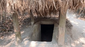 dungeon entrance tunnel camouflaged Cu Chi tunnels were the Viet Cong's base of operations for the Tet Offensive in 1968. Famous tourist attraction in Vietnam