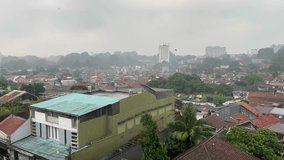 Cileungsi, Bogor - 06 June 2024 - Video of residential housing or slum area in Asia city, rain weather poor area clip or footage