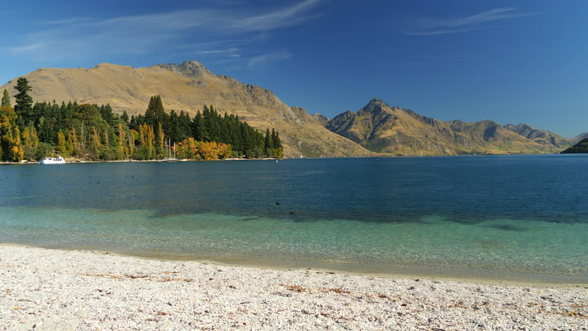 Queenstown Bay Beach, New Zealand - panorama of the stunning landscape and Lake Wakatipu